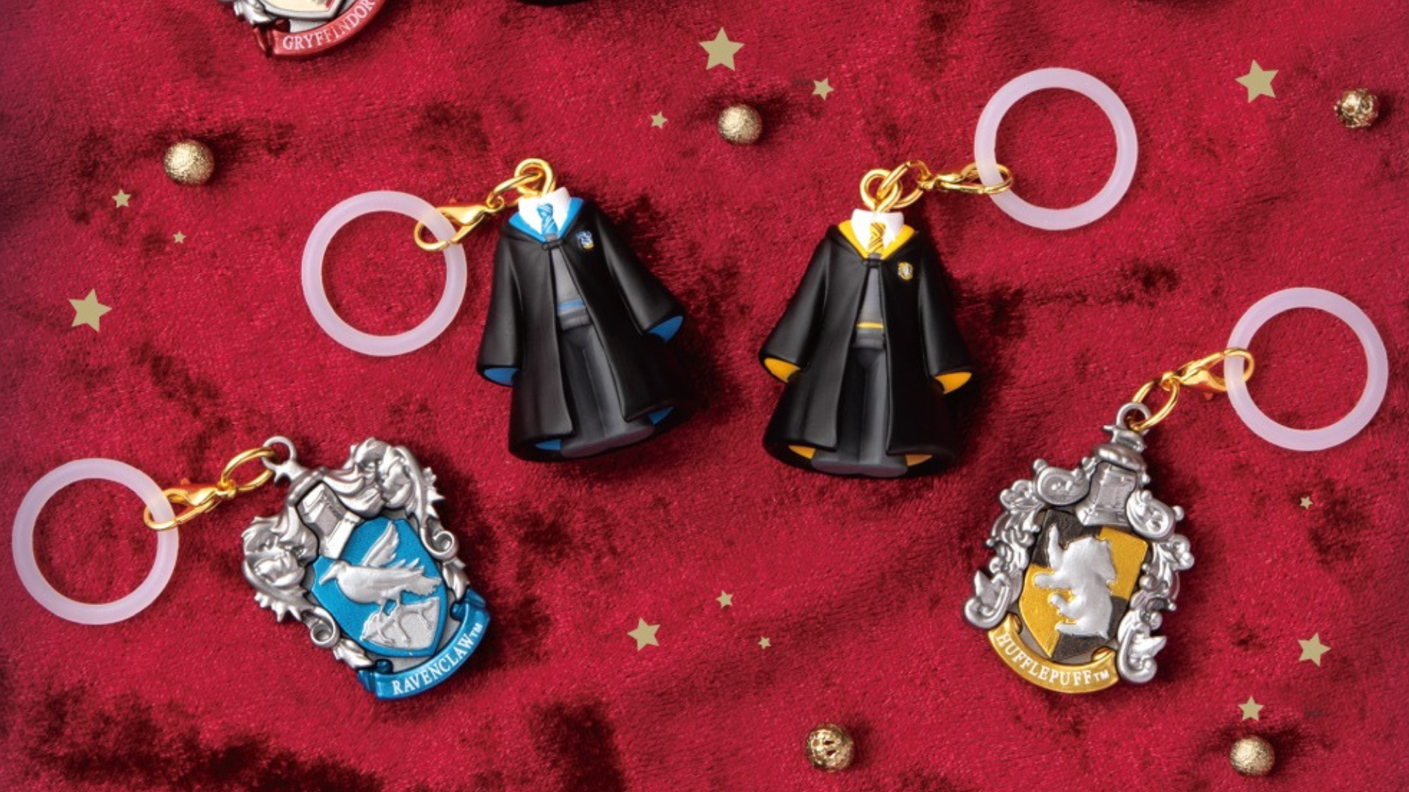 Harry Potter Mejirushi Accessory gashapon charms showing the four Hogwarts house uniform designs and crests