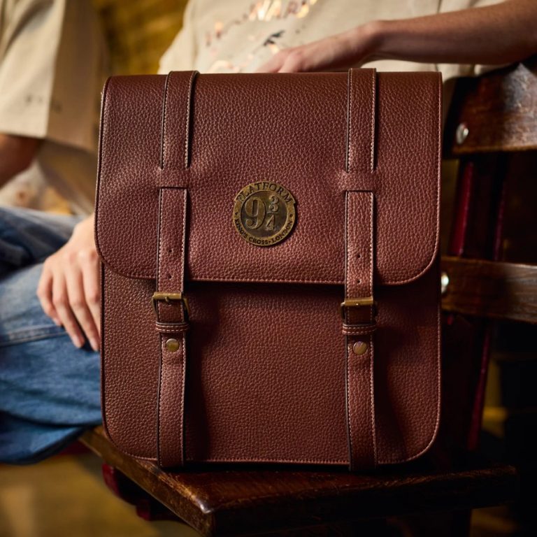 The Back to Hogwarts 2026 backpack in brown with a brass-effect Platform Nine and Three Quarters emblem and buckled straps