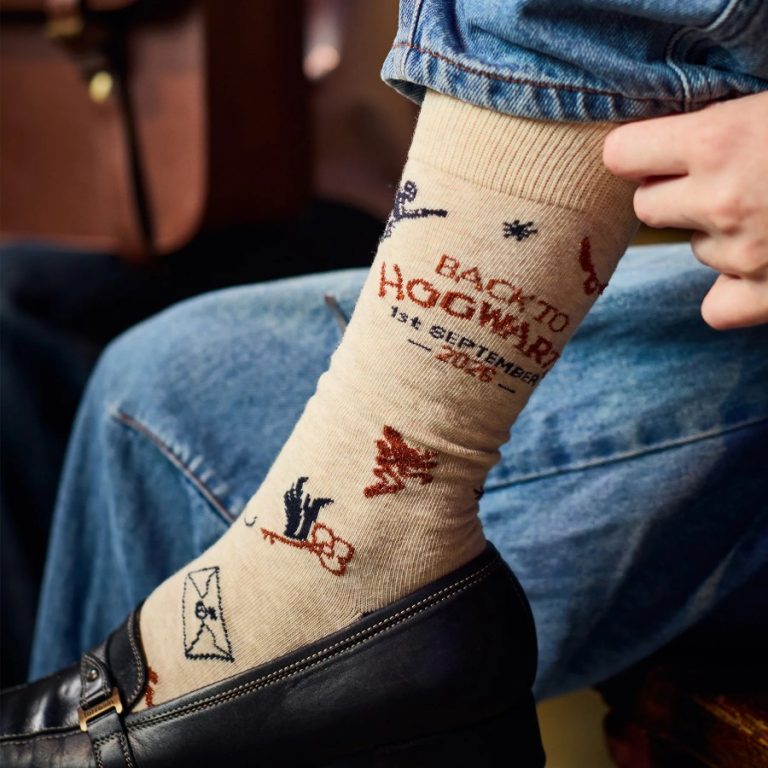The cream Back to Hogwarts 2026 socks knitted with the 1st September 2026 date and wizarding motifs